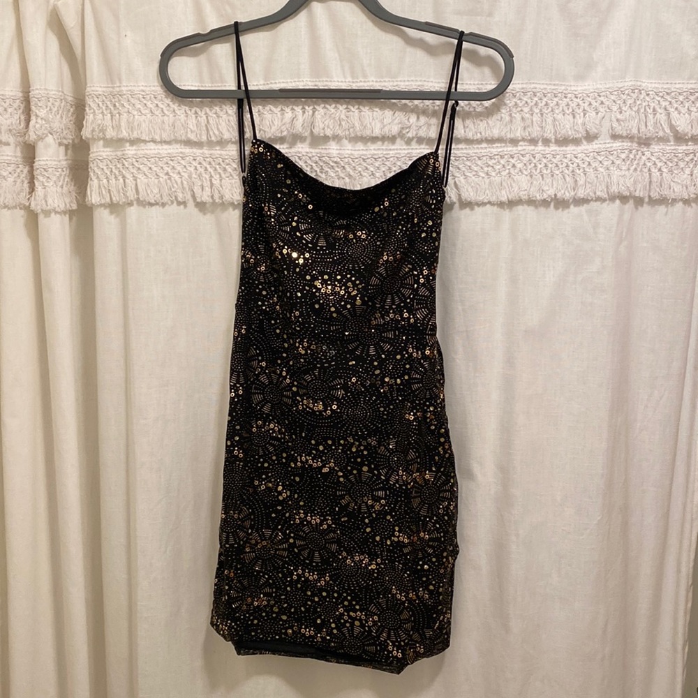 Brand new black and gold mini dress